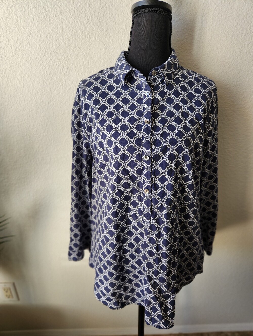 Women's Geometric design half-button top features a blue and white pattern